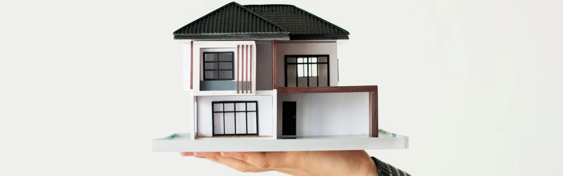 hand-presenting-model-house-home-loan-campaign